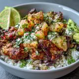 Tropical-inspired chicken pineapple taco bowls featuring tender spiced chicken, creamy coconut rice, and zesty pineapple salsa for a fresh meal.  