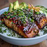 Quick and easy teriyaki salmon bowl featuring tender glazed salmon, crisp vegetables, and fluffy rice in 15 minutes.