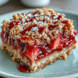 Delicious Strawberry Rhubarb Crumble Bars with tender fruit and buttery topping.