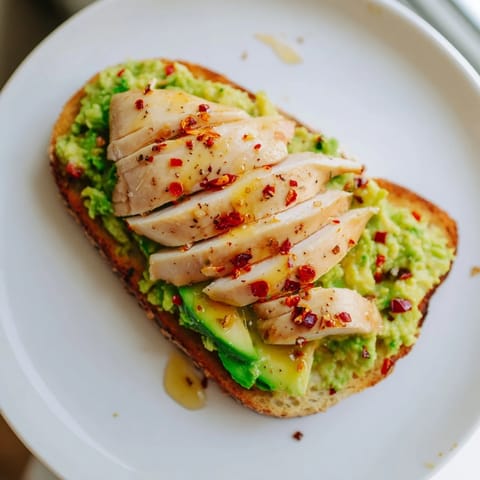 Crisp sourdough topped with creamy smashed avocado and juicy grilled chicken, finished with chili flakes and honey.