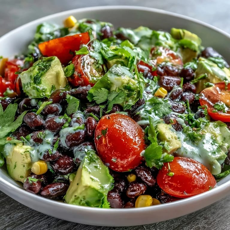 Vibrant Black Bean and Veggie Bowl featuring creamy avocado, juicy tomatoes, and hearty black beans, ready to serve.