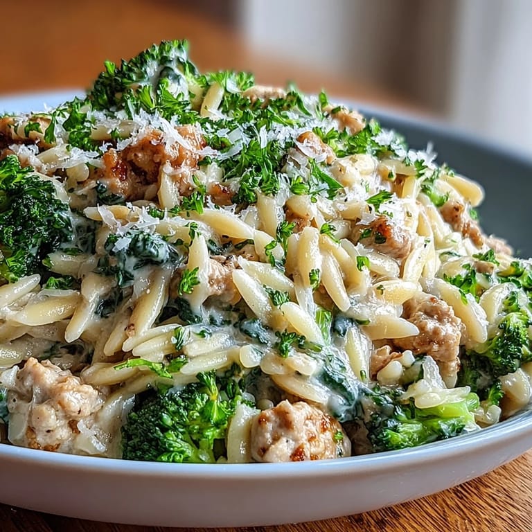 Tender turkey mince and al dente orzo mingle with broccoli in a creamy sauce, served hot.