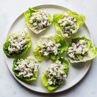 Juicy shredded chicken, crisp chopped pickles, and fresh dill tossed in creamy dressing, served in butter lettuce cups for a refreshing low-carb meal.  