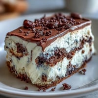 Black sesame tiramisu, a creamy Italian-Japanese dessert, richly infused with nutty paste.